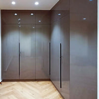 Glossy brown L-shaped modular wardrobe with handle-free design.
