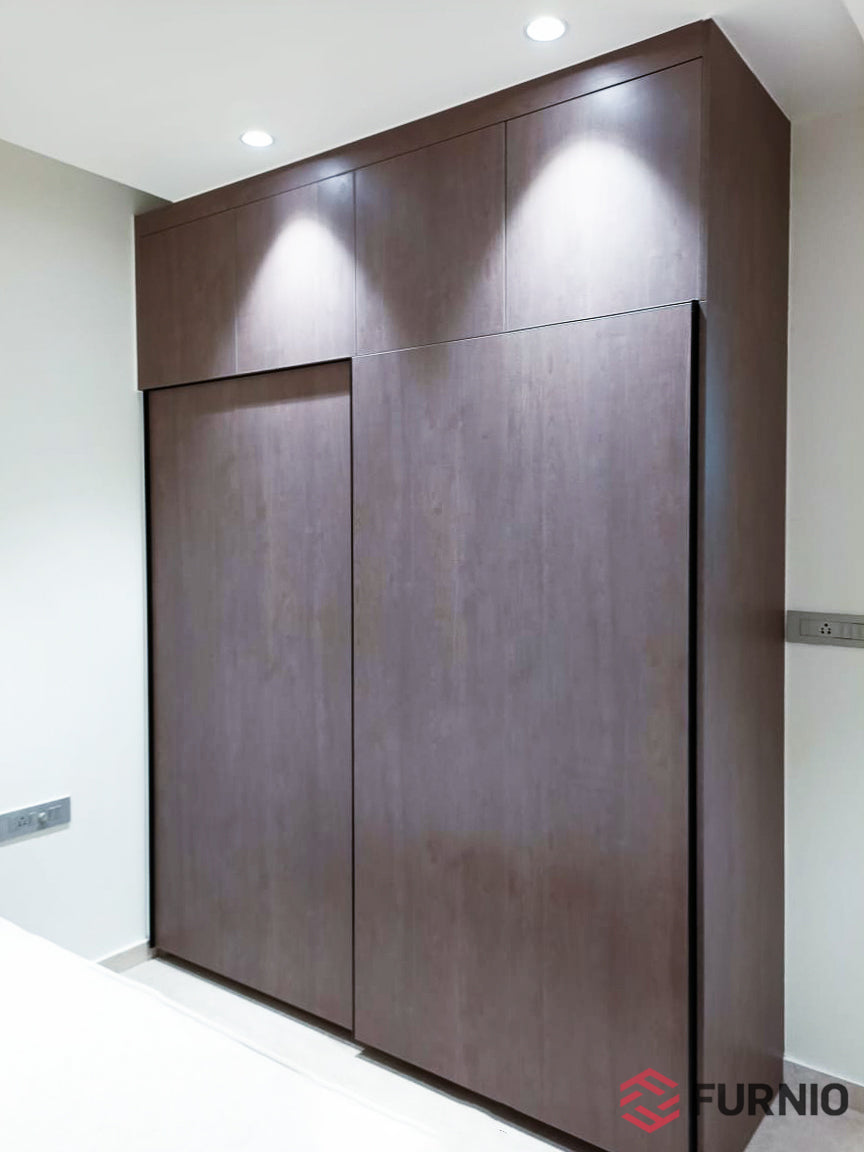 Dark laminate wardrobe with loft cabinets
