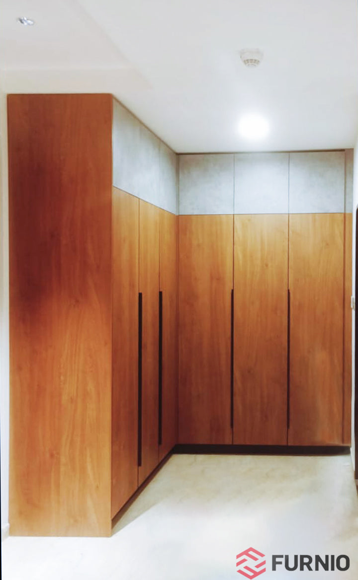 Minimalist wooden wardrobe with sleek handles and a modern design