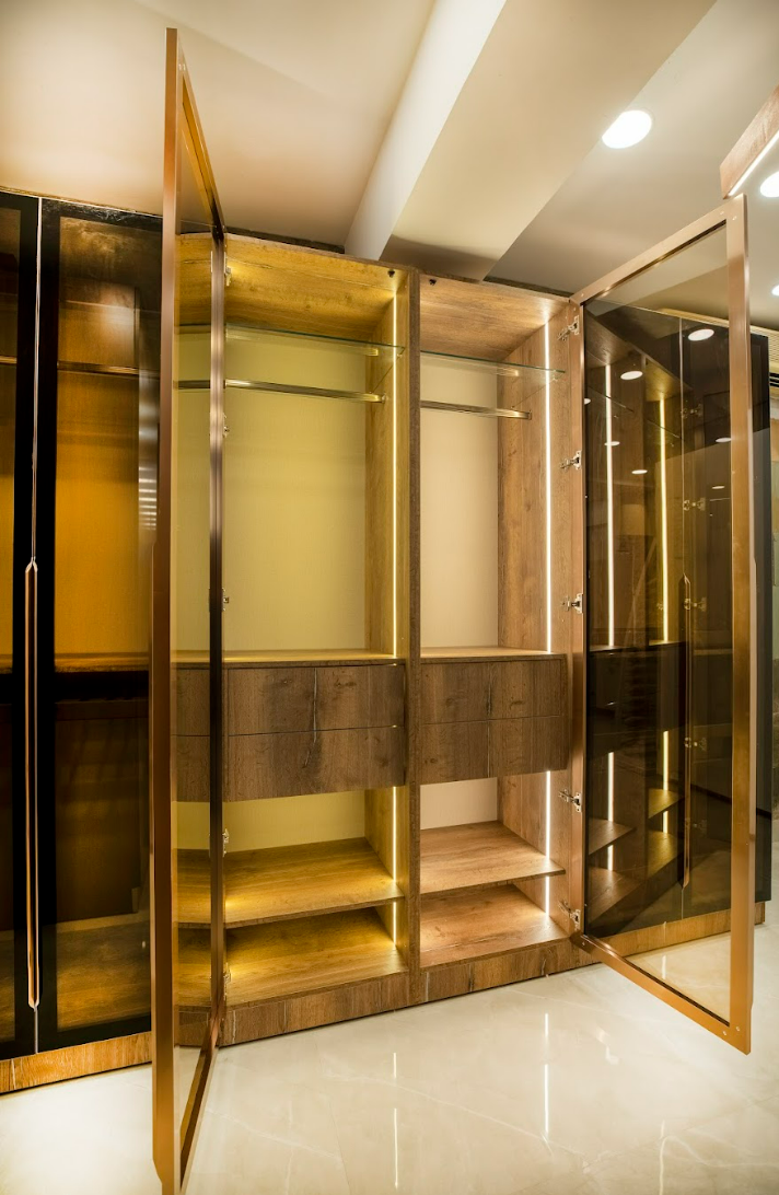 Elegant wooden cabinet with glass doors and built-in lighting.