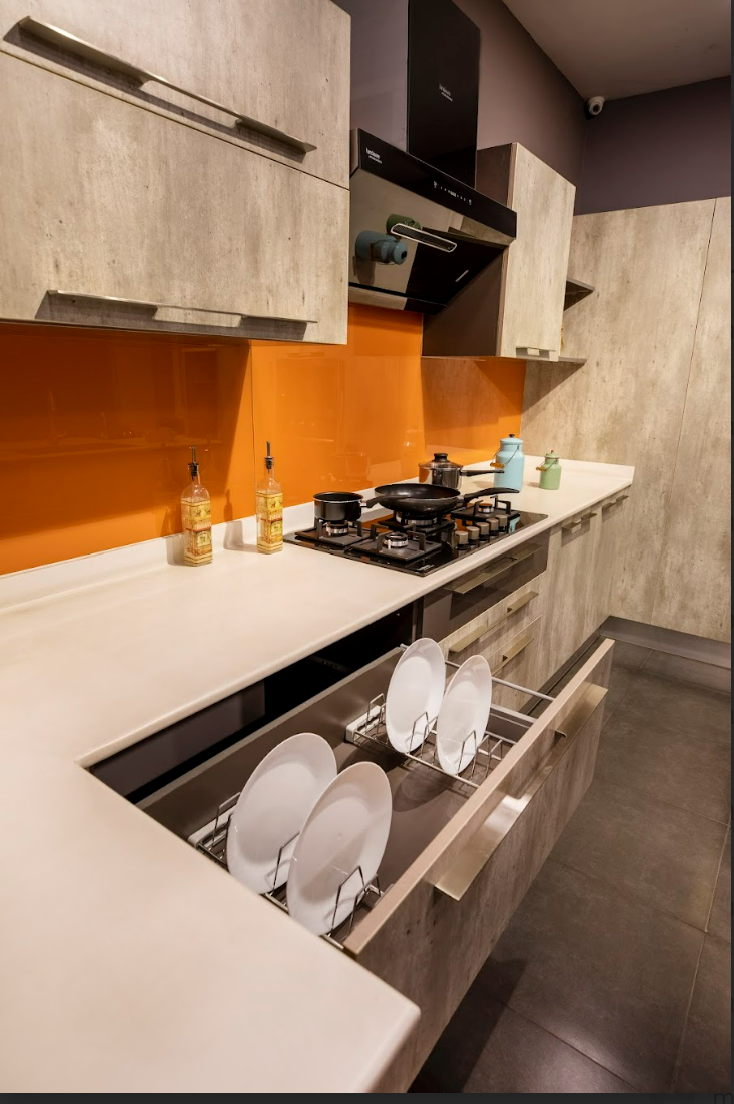 Beige kitchen with orange backsplash and sleek storage