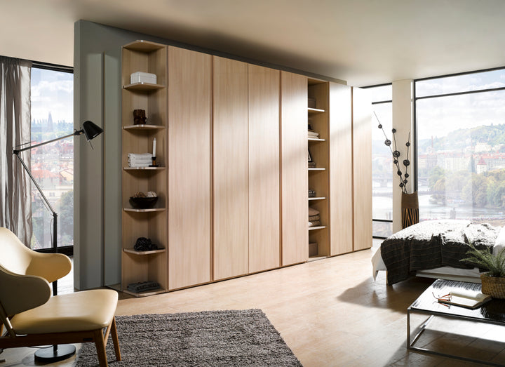 Minimalist bedroom interior with large wardrobe and chair