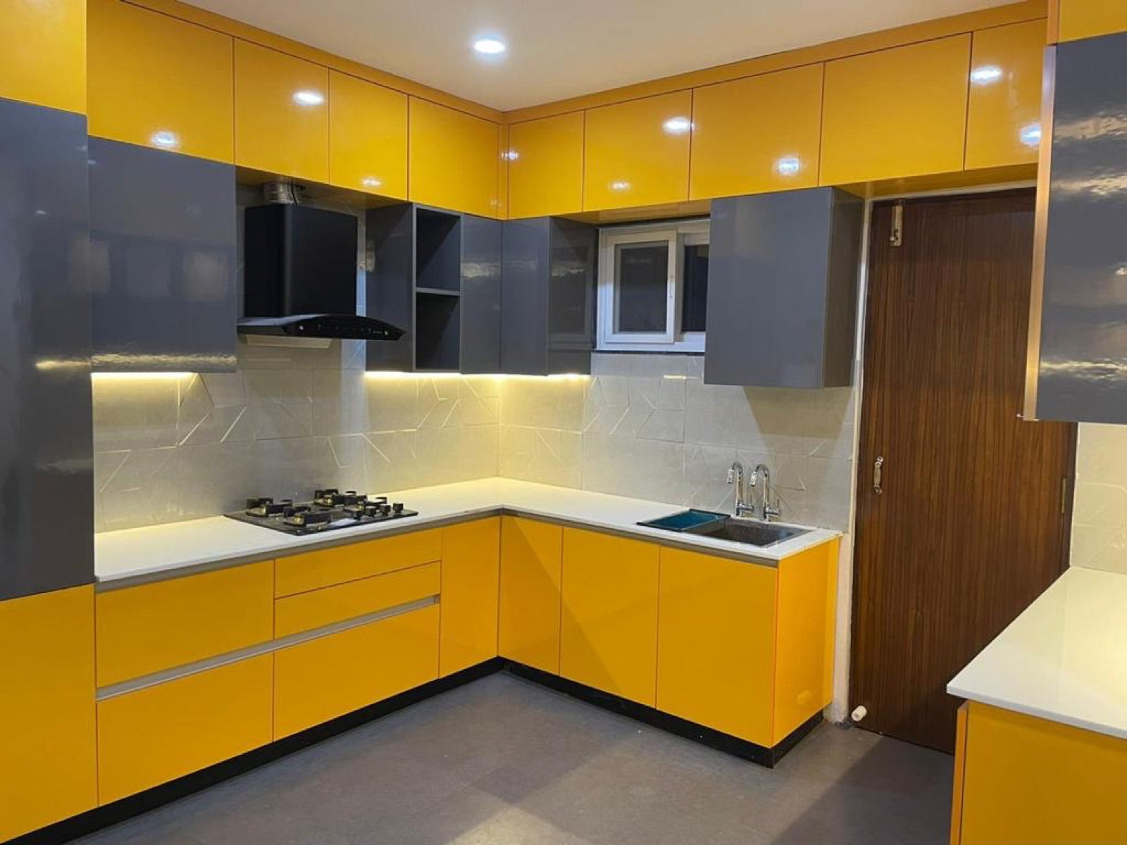 Yellow gloss L-shaped kitchen