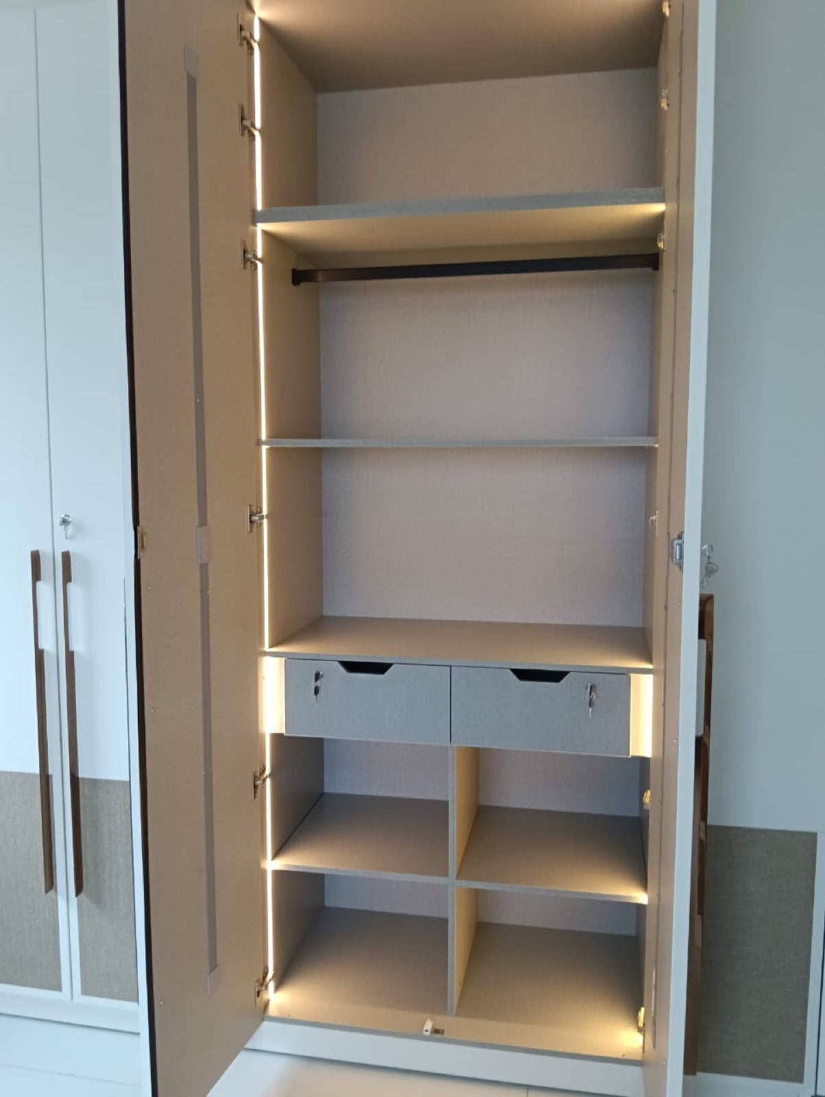 Wardrobe internals · lit shelves