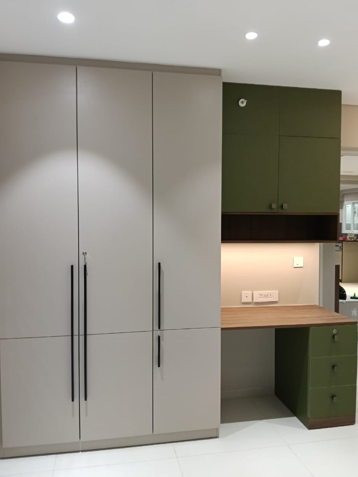 Wardrobe and study nook · olive-green desk cabinets with floating shelf