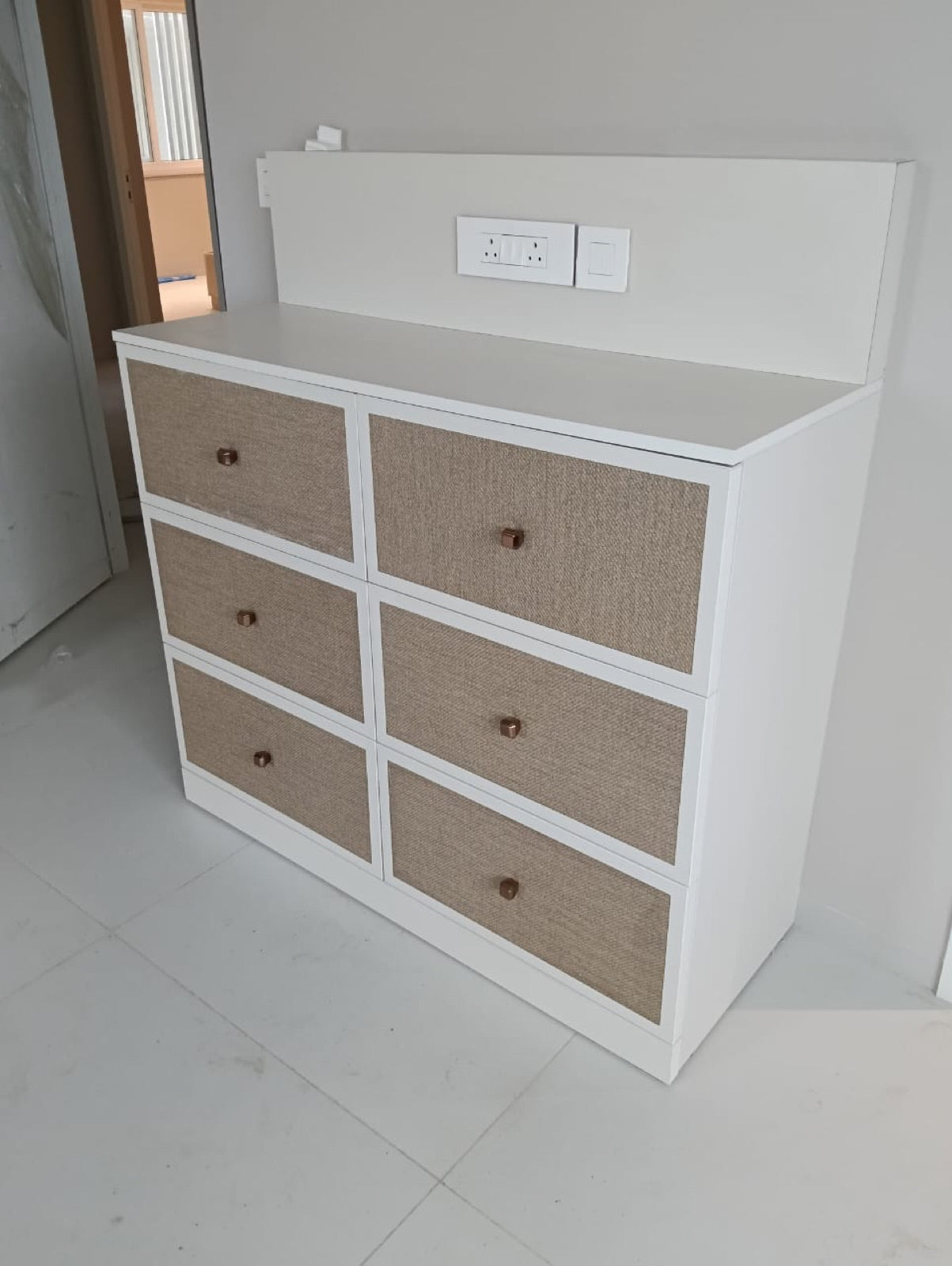 Chest of drawers · white carcass with cane-textured drawer fronts