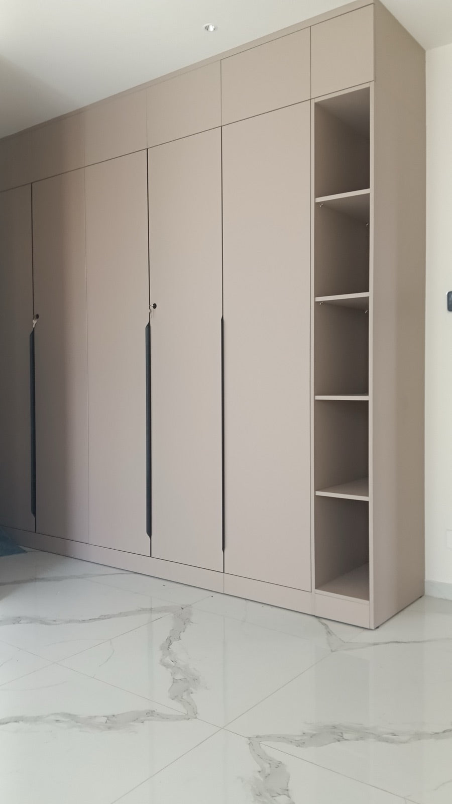 Wardrobe · taupe finish with lit open shelving bay