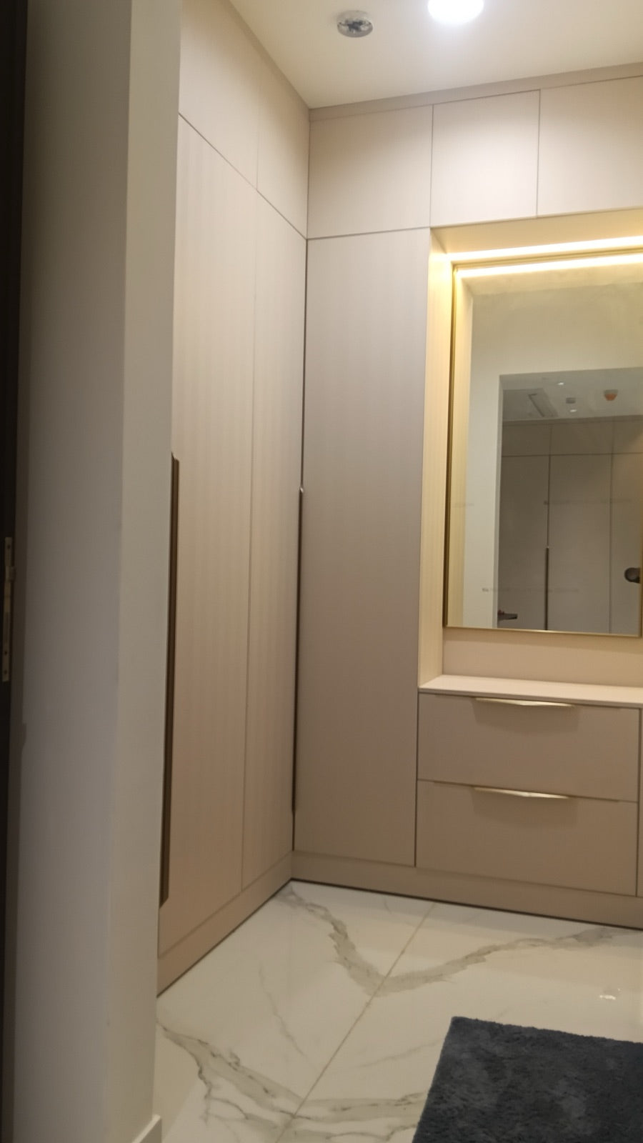 Corner wardrobe and dressing table with backlit mirror