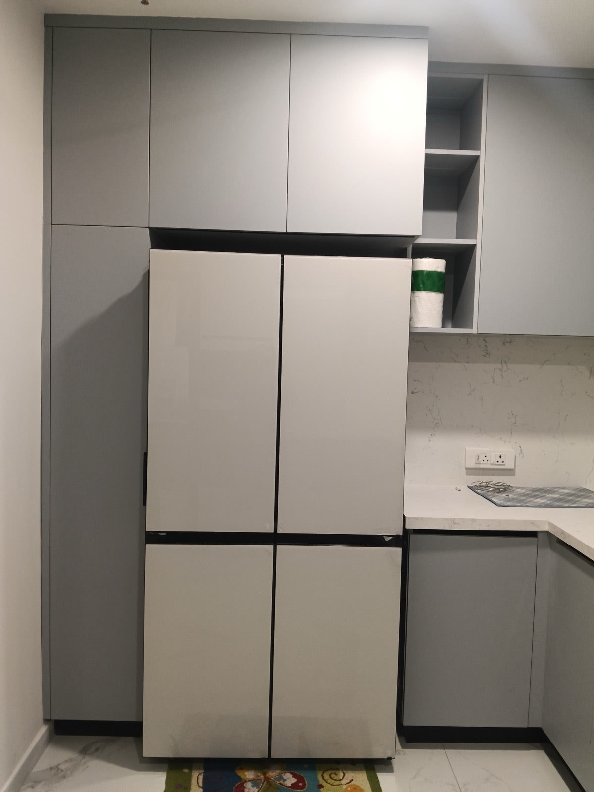 Kitchen tall unit · integrated fridge bay with matching grey finish