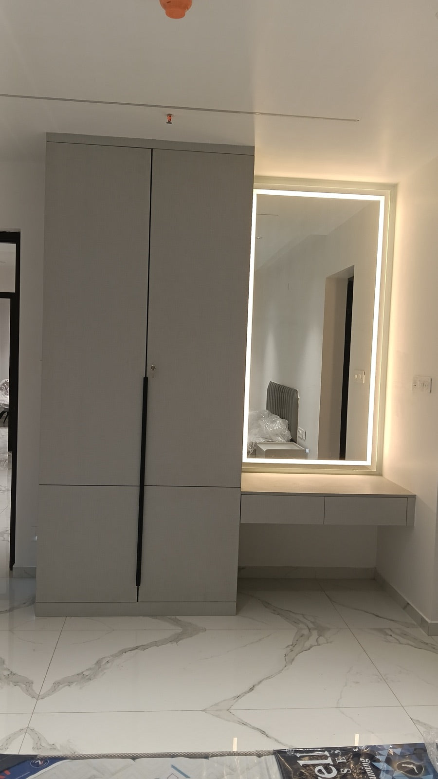 Vanity nook · backlit LED mirror over floating dresser